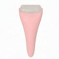 Pink ice roller facial massager on white background