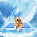 Golden retriever lying on a blue self-cooling gel dog mat