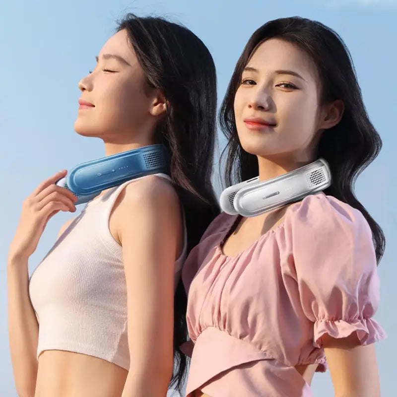Two women wearing white and blue hands-free neck fans outdoors